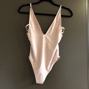 Nude V-Neck/Low Back Strappy One Piece Swimsuit.